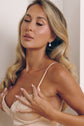 Model wearing the Monroe silver-tone pear drop earrings