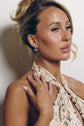 Model wearing the Raine marquise drop earrings