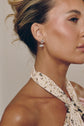 Model wearing the Raine marquise drop earrings