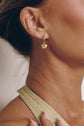 Model wearing the Mira Drop Earrings with Mira Charms