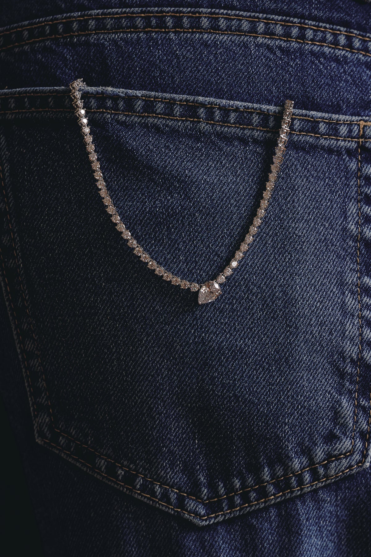 Fawnie Necklace, tennis necklace with a pear-cut centre stone