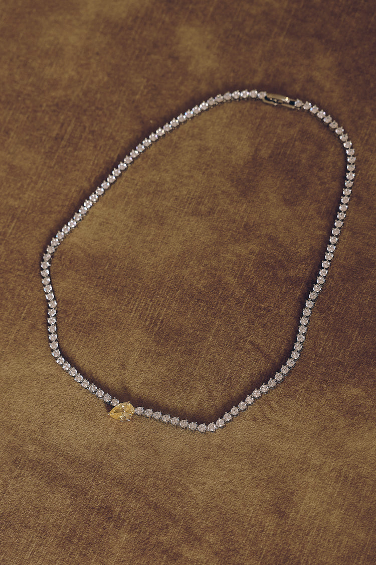 Fawnie Necklace, tennis necklace with a pear-cut centre stone