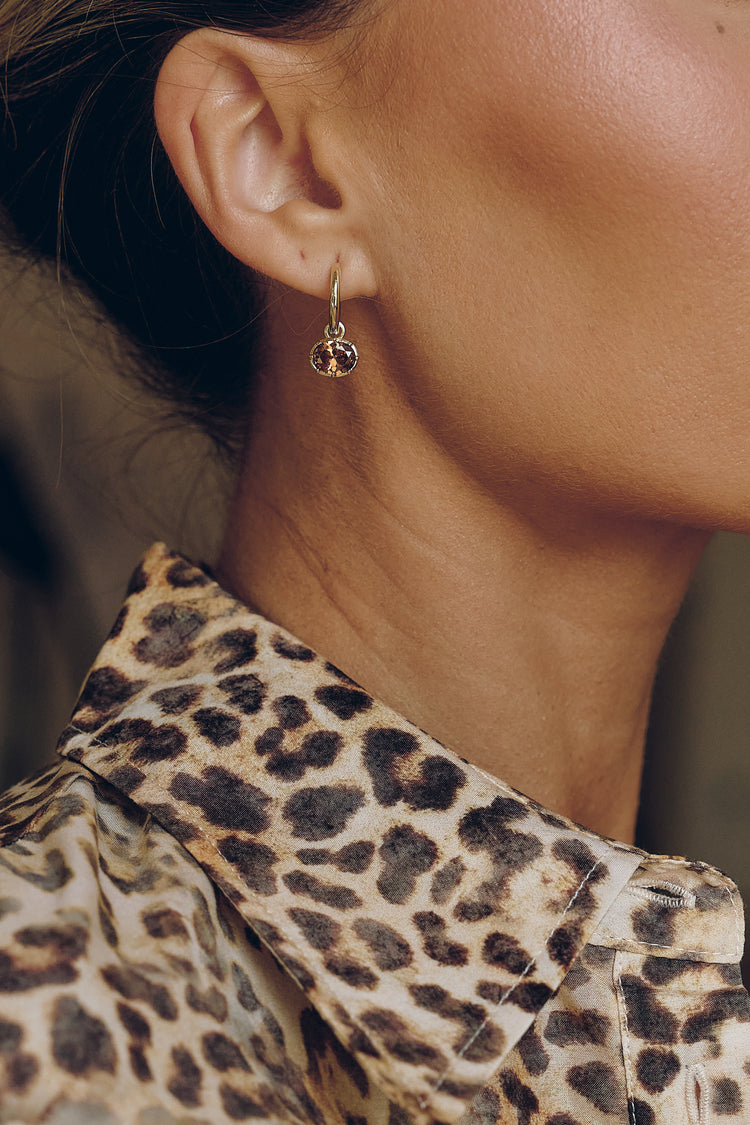 Model wearing the Mira Drop Earrings with Mira Charms